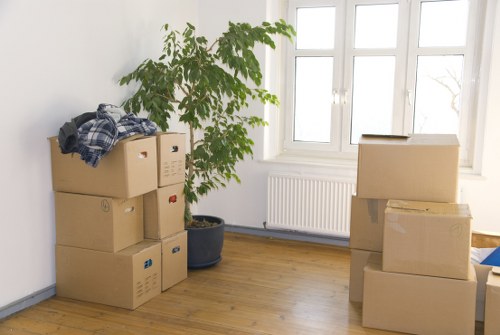 Commercial moving crew handling office furniture in Motspurpark
